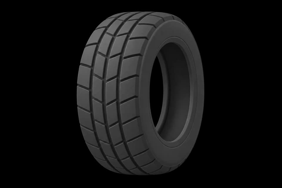 An automotive tire shown without a wheel